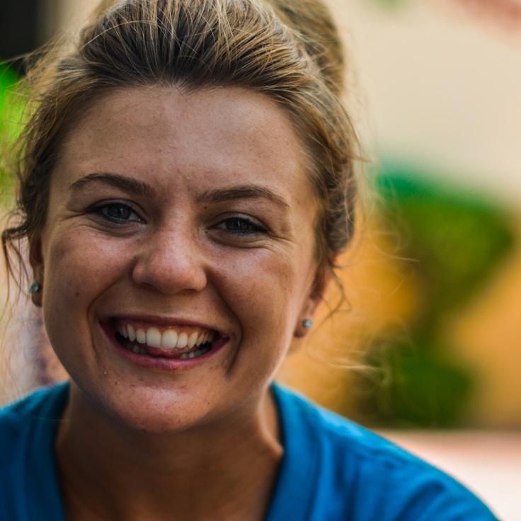 Kaveri Mehta, Lead Design Curator at LumenRibbonForest, reviewing corporate floral arrangements